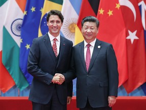 Chinese President Xi Jinping (right) shakes hands with Canadian Prime Minister Justin Trudeau to the G20 Summit on September 4, 2016 in Hangzhou, China. World leaders are gathering in Hangzhou for the 11th G20 Leaders Summit from September 4 to 5. (Photo by Lintao Zhang/Getty Images)