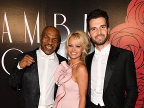Mike Tyson, Pamela Anderson, Andrea Iervolino put on the smiles at the AMBI Gala. AMBI