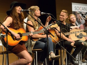 Zoe Neuman and Ali Raney of the Lovelocks perform during a songwriters workshop at the Wolf Performance Hall, part of the Canadian Country Music Association Awards week. At right is Mike Robins. (MORRIS LAMONT, The London Free Press)