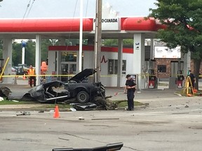 Police investigate after a deadly, high-speed, two-car crash at Highbury Avenue and Dundas Street early Thursday. The collision killed two, sent three others to hospital and snarled traffic in the area for much of the day. (DEREK RUTTAN, The London Free Press)