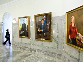 A painting of former Alberta Premier Alison Redford hangs in the Alberta Legislature amongst past premiers Ralph Klein and Ed Stelmach, in Edmonton on Thursday, September 8, 2016. THE CANADIAN PRESS/Jason Franson