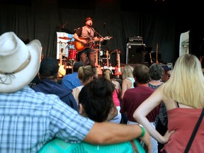 Aaron Allen, a Fanshawe College alum, warms up the crowd for the Canadian Country Music Association Awards kickoff concert on Talbot Street across from Budweiser Gardens Thursday night. (MIKE HENSEN, The London Free Press)