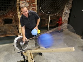 Pump House Steam Museum curator Gord Robinson launches a balloon from the air cannon at the museum's new Learning Lab exhibit in Kingston, Ont. on Thursday, Sept. 8, 2016. Elliot Ferguson/The Whig-Standard/Postmedia Network