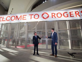 EDMONTON ALBERTA: September 8, 2016 Daryl Katz and Mayor Don Iveson pull the banner open during the grand opening of Rogers Place, in Edmonton September 8, 2016. AMBER BRACKEN/Postmedia