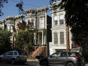 This May 27, 2016 file photo shows a Victorian home, center, made famous by the television show "Full House." The home is now available to rent for $13,950 a month. The 1883 villa was put on the market in May with a $4.15 million price tag, but it didn't sell. (AP Photo/Eric Risberg,File)