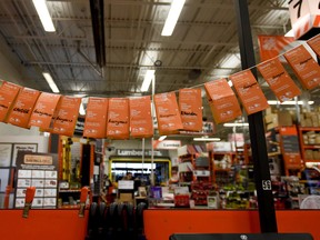 Paper orange doors bought by Home Depot customers who donated $2 to Youth Empowerment and Support Services (YESS) in Spruce Grove on Wednesday, Sept. 7, 2016. The project pays for the annual salary of one staff worker at YESS, an organization which helps older youth get back on their feet. - Photo by Yasmin Mayne