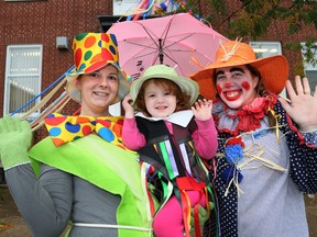 The "Invasion of Scarecrows” in Meaford will begin in mid-September and run through until mid-October. More than 250 scarecrows will be seen in the downtown area alone - dangling sassily from downtown lamp posts, hiding in bushes and trees, lounging happily on benches, peeking out from behind cornstalks and resting comfortably on porches and verandas.  In this file photo from 2013 are: Tabitha Pearce, left, and her daughter Myah, 3 and Jody Seeley, right. James Masters/File photo/Postmedia Network