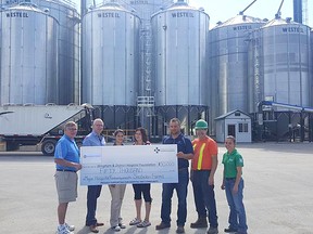 Snobelen Farms has committed $50,000 to the Wingham & District Hospital Foundation redevelopment campaign after a donation Aug. 29, 2016. L-R: Ian Montgomery and Mark Foxton representing the WDH Foundation with Lily Ferreira, Andrea Cordes, Troy Snobelen, Marvin Cook and Shannon Bieman representing Snobelen Farms.