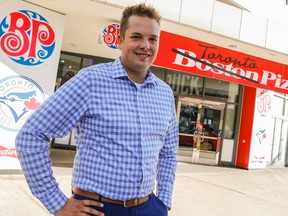 Regional Business Manager for Boston Pizza Niels Van Oyen stands in front of the Boston Pizza at the corner of John St. and Front St. in Toronto where they have temporally changed the name to Toronto Pizza in support go the Blue Jays who will be hosting the Boston Red Sox on Friday September 9, 2016. Dave Thomas/Toronto Sun/Postmedia Network