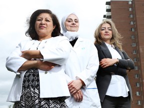 Sawsan Abdul-Majid with program participants Farzan Asbhi, who has a master's degree in pharmacy and Fedaa Khirallah, an agricultural engineer. Tony Caldwell / Postmedia