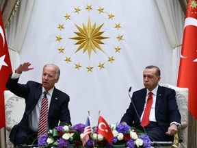 U. S. Vice President Joe Biden, left, and Turkish President Recep Tayyip Erdogan speak to the media after a meeting in Ankara, Turkey, Wednesday, Aug. 24, 2016. Biden called on Turkish authorities on Wednesday to be patient with the U.S. legal system as Turkey seeks the return of the cleric accused of masterminding last month's failed military coup, Fethullah Gulen, saying the extradition process would take time. (Kayhan Ozer, Presidential Press Service Pool via AP)