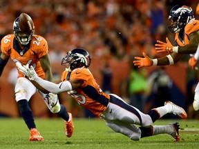 Cornerback Chris Harris of the Denver Broncos intercepts a pass against the Carolina Panthers at Sports Authority Field at Mile High on September 8, 2016 in Denver. (Dustin Bradford/Getty Images)
