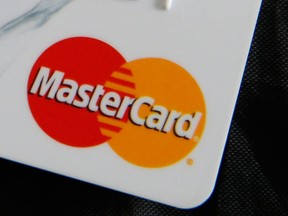 In this photo illustration a detail of a MasterCard credit card showing the logo of the card in London, Friday, Sept. 9, 2016. (AP Photo/Alastair Grant)