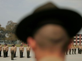 A United States Marine Corps drill instructor watches recruits on the parade deck during boot camp at Parris Island, S.C., in this March 8, 2007 file photo.   (Scott Olson/Getty Images)