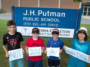 Jonas Wright, 12, (from left), Dominick Martin, 11, Erin Childs, 11, and Hari Adnani, 11, all attending J.H. Putman, a middle school that the public school board is recommending be closed. These kids and their parents want the school to remain open.   Wayne Cuddington/ Postmedia
