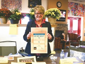 Marilyn Gore, a member of the Vulcan Suicide Prevention Steering Committee, offers information about the committee and suicide prevention at Market Street.