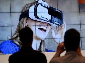 This file photo taken on September 5, 2014 shows visitors attending a presentation of the virtual reality headset Gear VR at the booth of South Korean electronic giant Samsung on the opening day of the consumer electronics trade fair "Internationale Funk Ausstellung "(IFA) in Berlin. (TOBIAS SCHWARZTOBIAS SCHWARZ/AFP/Getty Images)