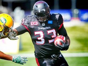 Calgary Stampeders Jerome Messam runs the ball against Edmonton Eskimos during CFL football in Calgary, Alta., on Monday, September 5, 2016.