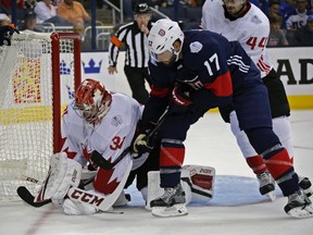 Team Canada's Carey Price makes a save against Team USA's Ryan Kesler during the first period of a World Cup of Hokey game at Nationwide Arena in Columbus, Ohio, Friday, Sept. 9, 2016. (Kyle Robertson/The Columbus Dispatch via AP)