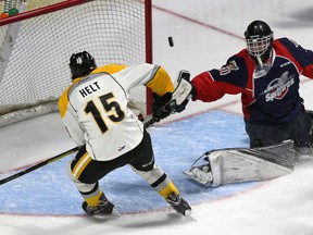 Windsor Spitfires goaltender Lucas Patton and Sarnia Sting Filip Helt, left, try to control a rebound in OHL pre-season action from WFCU Centre, September 9, 2016. (NICK BRANCACCIO/Windsor Star)