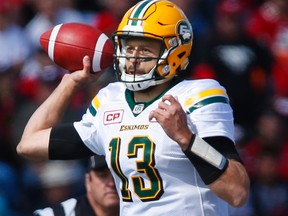 Edmonton Eskimos quarterback Mike Reilly throws the ball during first half CFL football action against the Calgary Stampeders in Calgary, Monday, Sept. 5, 2016.