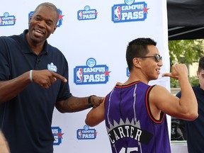 Former NBA star Antonio Davis (left) enjoys the Vince Carter jersey worn by Henry Huang during an autograph session as part of NBA Campus Pass at the University of Manitoba on Fri., Sept. 9, 2016. (Kevin King/Winnipeg Sun/Postmedia Network)