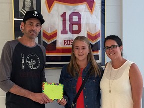 Eighteen-year-old Emma Forcey, centre, of London is this year's recipient of the Christie Rose PWHL Scholarship. The award is named after Rose, a Fingal native who died in 2008 from injuries sustained in an automobile accident. Making the presentation are Christie's brother Joe and sister Lauren.