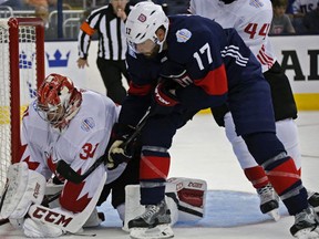 Team Canada's Carey Price makes a save against Team USA's Ryan Kesler during the first period of a World Cup of Hokey game at Nationwide Arena in Columbus, Ohio, Friday, Sept. 9, 2016. (Kyle Robertson/The Columbus Dispatch via AP)