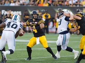 Hamilton Tiger-Cats quarterback Zach Collaros (4) gets ready to throw under pressure in the pocket during first half CFL football action against the Toronto Argonauts in Hamilton, Ont., on Monday, September 5, 2016. THE CANADIAN PRESS/Peter Power