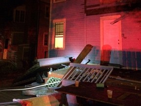 This photo provided by the Hartford Police Department shows a collapsed deck at a house near Trinity College in Hartford, Conn., Saturday, Sept. 10, 2016. Deputy Chief Brian Foley of the Hartford police posted on his Twitter feed that a third-floor deck of a house about two-tenths of a mile from the Trinity campus collapsed onto a second-floor deck, which subsequently fell onto a first-floor deck. Foley says the injured have been sent to area hospitals. (Hartford Police Department via AP)