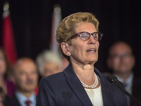 Ontario Premier Kathleen Wynne talks to media at her first press conference after the announcement of a cabinet shuffle at Queen's Park in Toronto, on Monday June 13, 2016. (THE CANADIAN PRESS/Eduardo Lima)