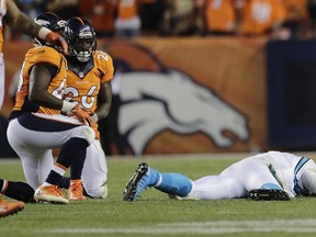 Carolina Panthers quarterback Cam Newton (1) lies on the turf during the second half of an NFL game Thursday, Sept. 8, 2016, in Denver. (AP Photo/Joe Mahoney)