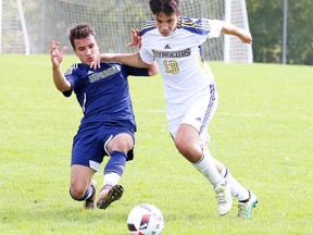 Laurentian Voyageurs' Nicholas Correa fights for the ball against a member of the Nipissing Lakers during OUA men's soccer action at the LU pitch earlier this season.