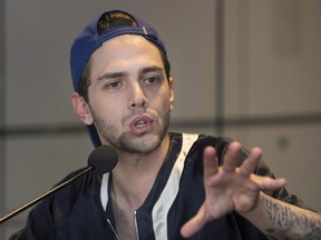 Filmmaker Xavier Dolan speaks to reporters in Montreal on May 23, 2016. (THE CANADIAN PRESS/Graham Hughes)