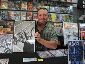 Writer Davis Dewsbury showcases the new cover and original art for the second installment of his comic series Auric of the Great White North, which was released at Jump City in Timmins on Saturday.