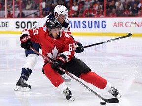 Team Canada’s Brad Marchand skates the puck as Team USA’s Ryan Suter tries to defend during pre-tournament World Cup of Hockey action in Ottawa on Saturday, Sept. 10, 2016. (THE CANADIAN PRESS/Sean Kilpatrick)