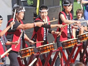Kings Don Taiko performs traditional Japanese Taiko Drumming at the Kingston Multicultural Arts festival in Confederation Park on Sunday. (Steph Crosier/The Whig-Standard)