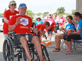 Nona Mariotti and her husband Elso, who has Parkinson's disease, participate in the Parkinson Super Walk at the Memorial Centre on Saturday. (Steph Crosier/The Whig-Standard)