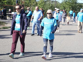 Participants hit the pavement in the Kidney Walk at Delki Dozzi Memorial Park on Sunday. Transplant recipients, living donors, donor families, dialysis patients, renal professionals and friends and families rallied together to take steps to create a better future for the one  in 10 Canadians living with kidney disease. (Gino Donato/Sudbury Star)