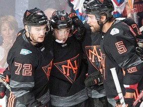 Team North America’s Johnny Gaudreau (13) celebrates his second goal with teammates Jonathan Drouin (72) and Aaron Ekblad (5) in pre-tournament World Cup action against Europe Sunday, September 11, 2016 in Montreal. (THE CANADIAN PRESS/Ryan Remiorz)