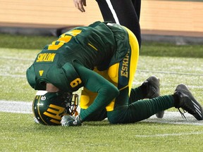 Eskimos Patrick Watkins reacts to the Calgary Stampeders touchdown in overtime Saturday at Commonwealth Stadium. (The Canadian Press)