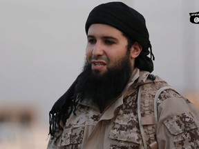 An image grab taken from a video made available by jihadist media outlet Welayat Nineveh on July 20, 2016, allegedly shows Rachid Kassim, a French member of the Islamic State group (IS), speaking in French to the camera from an undisclosed location before beheading two men along with an other jihadist.  (AFP PHOTO / HO / WELAYAT NINEVEH)