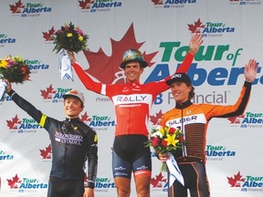 Tour of Alberta Stage 3 winners - first -  Evan Huffman; second - Robin Carpenter; third - Kristofer Dahl at the podium in Drayton Valley following the finish of Stage 3. Huffman is wearing a specially painted hard hat from the Town.