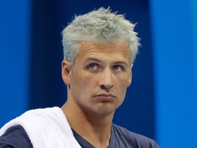 In this Aug. 9, 2016, file photo, United States' Ryan Lochte prepares before a men's 4x200-meter freestyle heat at the 2016 Summer Olympics, in Rio de Janeiro, Brazil. Lochte says he feels "a little hurt" after being involved in an incident on "Dancing with the Stars" that prompted producers to cut to a commercial. The beleaguered swimmer was apparently rushed by unknown people while receiving his scores from Judge Carrie Ann Inaba on the Monday, Sept. 12, 2016, live installment of the celebrity ballroom dance competition. (AP Photo/Michael Sohn, File)