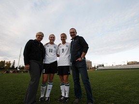Janice (from left), Kate, Anna and John Dunn pose for a photo after the University of Alberta Pandas played the University of Manitoba Bisons at Foote Field on Friday. (Ian Kucerak)