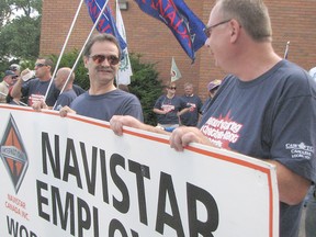 Trevor Terfloth/Postmedia Network
Navistar employees Tony Hendriks, left, and Dan Decan march to the Chatham-Kent Civic Centre in 2010 with other Navistar employees. Many previous Navistar employees found it difficult to find similar employment after the closure.