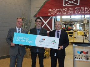 Western Fair District board chair Tim Kelly, left, and chief operating officer Michael Woods flank Growing Chefs! Ontario executive director Andrew Fleet at Tuesday?s partnership announcement at the Agriplex. (DALE CARRUTHERS, The London Free Press)