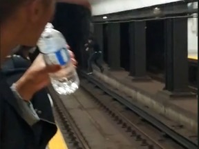 Social media has captured a dangerous stunt in which a man jumps on to subway tracks and scoots to the opposite platform. (Frame grab/streamable.com)