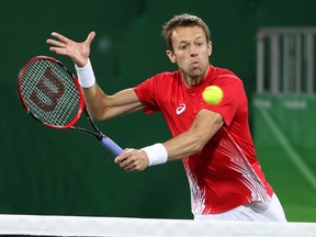 Daniel Nestor returns a shot during the men's doubles bronze medal match at the Rio 2016 Olympics in Rio de Janeiro, August 12, 2016. (Jean Levac/Postmedia Network)