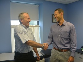 Dr. Peter Wakely shakes hands with Dr. Matt Clifford, who will be taking over Wakely's Corunna practice once Wakely retires in a few months time.
Submitted photo for SARNIA THIS WEEK